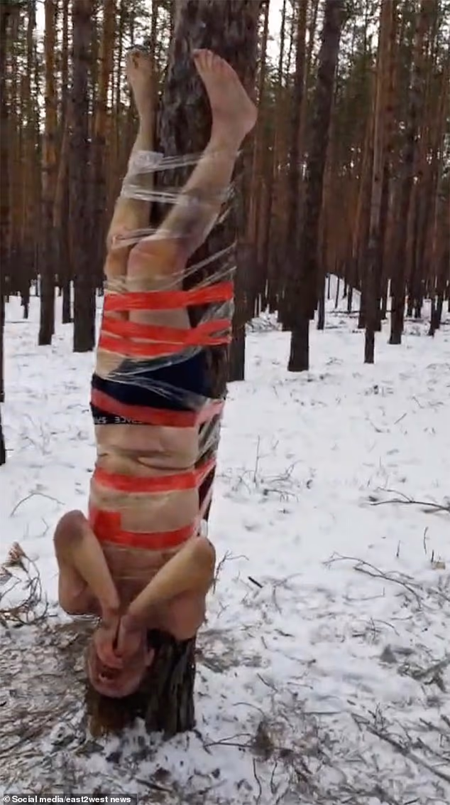 Russian soldiers reportedly taped upside down to a tree for refusing assaults