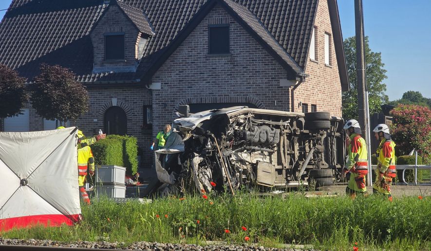 Train slams into school bus in Belgium, killing four and wounding five Train slams into school bus in Belgium, killing four and wounding five